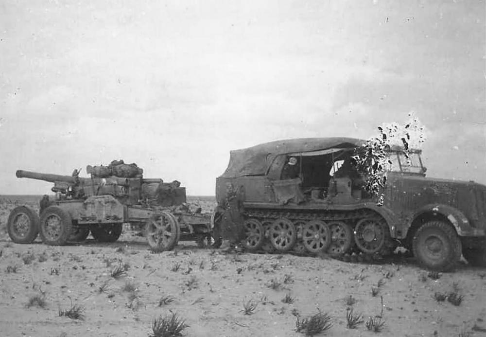 Click image for larger version  Name:	Sd.Kfz_._8_towing_a_gun_Afrika_korps_DAK.jpg Views:	0 Size:	94.5 KB ID:	245396