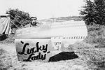 This photo shows how most P-38 nose art schemes were painted. Removal of the gun bay door meant the artist didn't have to work in the boiling sun.