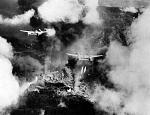 P-38s dropping Napalm, with AA tracers visible at the bottom of the image, and coming from right to left at the top Lightning.