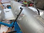 splitting the gun at the seam makes fishing the wire easier.  Here gluing it back together