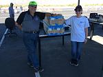 Pilot Evelyn presenting Motion RC raffle prizes to CD Bob Ruff.