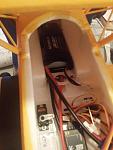 Battery as far forward as possible.