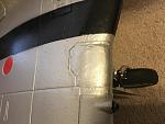Repaired/re-clear coated area over right MLG strut
