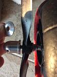 The part that is in my hand - I don’t know whether to place it between the spinner & prop or on the aft side of the prop.
