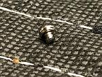 The top part of the screw