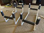 PVC cradles with foam pipe insulation.