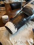 The gluing, spackle and body repair begins.