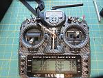I can display all battery cell voltages on my Taranis, and pulling a toggle switch during flight announces the flight time and the lowest cell voltage.