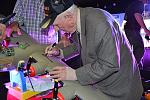 Bob Pedigo signing the wing of the B-24.