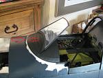 2) Lose about a 1/16th inch in width from FWD edge which moves the FWD windscreen both down and in alignment with the canopy bow.