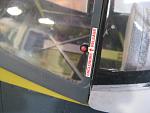 There is a hole through the canopy plastic. In reality, it is a flatter shaped button thingie, but...