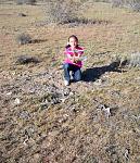 RC Pilot Evelyn (9 years old) holding parts at the ARPS F-104A impact site.