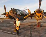 RC Pilot Evelyn standing in front of 23 Skidoo with pilot Steve Hinton sitting on the wing.