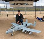 Pilot Evelyn and the AEF 'Best Scale Jet' hanging at the Motion RC booth.