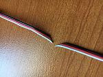 Neatly sliced by the fan.  Make sure you have minimal slack in your setup to avoid this.