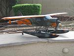 Photo #2, shows right side graphic panel of the aircraft. Sound system was added, details to float system to carry a canoe. Also added a servo for the float rudder, which was connected electrically to the tail rudder.