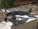 Photo #1 of  FMS 1450mm FW-190 shows under wing cannons made from brass tubing and foam. The paint scheme was hand and airbrushed painted.