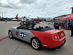 Tuskegee P-51B Mustang along with a Ford Mustang Tuskegee style.